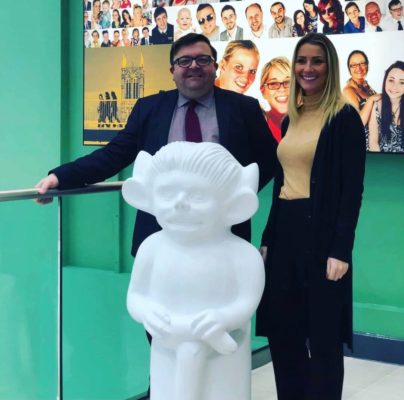 Man and women stood in front of a model imp